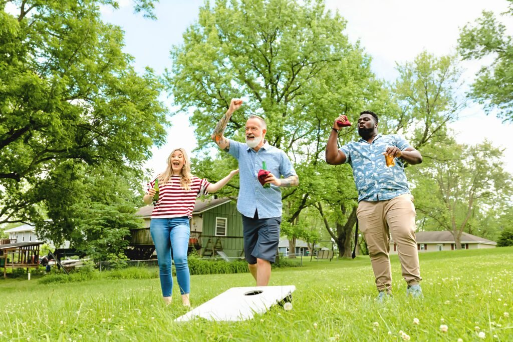Some adults pictured as they play outside.