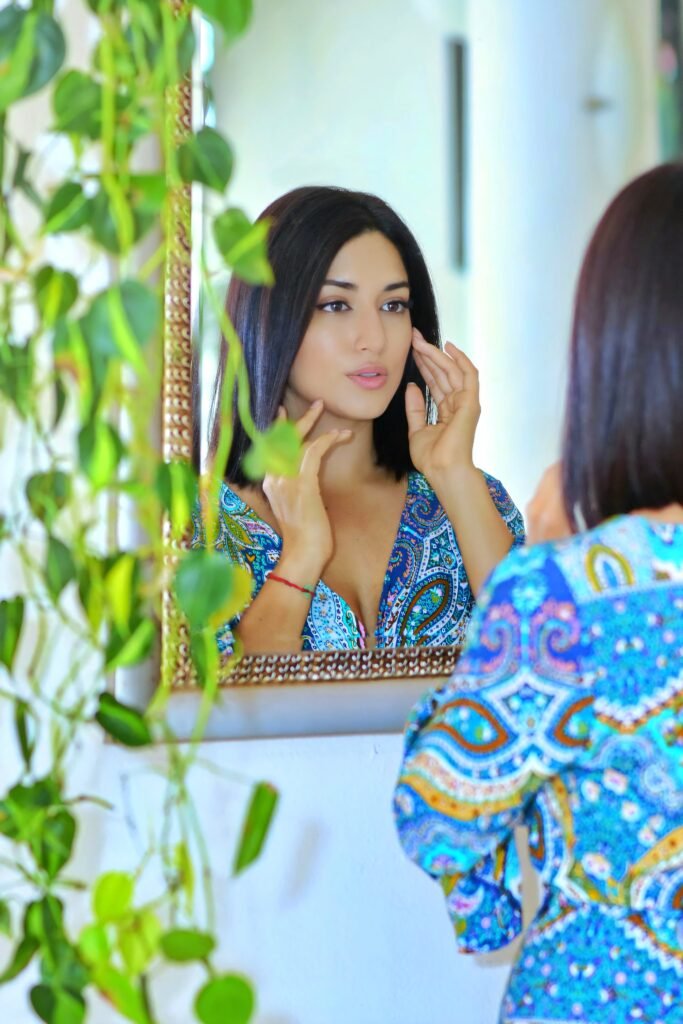 Woman Looks At Herself In The Mirror symbolising that life starts when we commit.